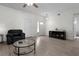 The living room features hardwood floors, three doors, a glass coffee table, and an entertainment stand at 725 N Grandview Ave, Daytona Beach, FL 32118