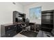 Office space with a dark wood desk, office chair, and a built-in bookshelf at 725 N Grandview Ave, Daytona Beach, FL 32118