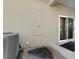 Exterior shower located on back patio with gray floor mat and AC Unit at 725 N Grandview Ave, Daytona Beach, FL 32118