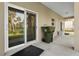 Covered patio with sliding glass door opening to backyard at 725 N Grandview Ave, Daytona Beach, FL 32118