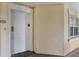 Welcoming condo entrance with a white door, side window, and unit number, creating a private and secure entry at 7660 Whisper Way # 402, Reunion, FL 34747