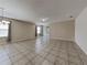 Bright, open living room with tile flooring and sliding door access to the backyard at 7806 Tanbier Dr, Orlando, FL 32818