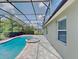 Screened in pool and patio combination next to home at 7806 Tanbier Dr, Orlando, FL 32818