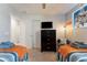 Playful bedroom designed with two beds, Star Wars decor, and a ceiling fan at 8122 Roseville Rd, Davenport, FL 33896