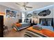 Playful bedroom designed with two beds, Star Wars decor, and a ceiling fan at 8122 Roseville Rd, Davenport, FL 33896