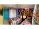 The bedroom has playful decor, a closet, and two twin beds at 8124 Roseville Rd, Davenport, FL 33896