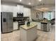 Bright kitchen featuring stainless steel appliances, granite countertops, a central island and open plan design at 8124 Roseville Rd, Davenport, FL 33896
