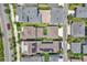 An overhead view showing the layout of houses with neatly manicured lawns and driveways, highlighting the neighborhood's design at 8226 Nemours Pkwy, Orlando, FL 32827