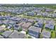 An aerial view of a residential neighborhood with well-maintained homes and lush landscaping at 8226 Nemours Pkwy, Orlando, FL 32827