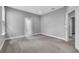 Large bedroom with carpet, neutral paint, and an ensuite bathroom at 8226 Nemours Pkwy, Orlando, FL 32827
