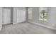This bright bedroom boasts carpeted floor, closet and an abundance of natural light at 8226 Nemours Pkwy, Orlando, FL 32827