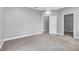 Neutral bedroom featuring carpeting and a view of a closet at 8226 Nemours Pkwy, Orlando, FL 32827