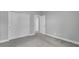 Bedroom with neutral walls, carpeted floor, and closet at 8226 Nemours Pkwy, Orlando, FL 32827