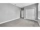 This bedroom features carpeted floor, ensuite bath, and a closet at 8226 Nemours Pkwy, Orlando, FL 32827