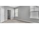 Neutral bedroom with carpeting, closet, and a double-hung window at 8226 Nemours Pkwy, Orlando, FL 32827