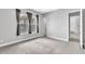 Bedroom featuring neutral walls, carpeted floor, and windows at 8226 Nemours Pkwy, Orlando, FL 32827