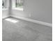 Carpeted bedroom with neutral walls, large windows, and ample natural light at 8226 Nemours Pkwy, Orlando, FL 32827