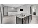 Open kitchen features granite countertops, stainless steel dishwasher, and sink on the kitchen island at 8226 Nemours Pkwy, Orlando, FL 32827