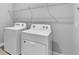 Convenient laundry area equipped with washer and dryer hookups, and storage at 8226 Nemours Pkwy, Orlando, FL 32827