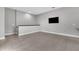 Spacious living room area upstairs with sleek tile floors, and neutral paint for a modern design at 8226 Nemours Pkwy, Orlando, FL 32827