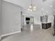 Open concept living room and kitchen area with modern finishes and lots of natural light at 8226 Nemours Pkwy, Orlando, FL 32827