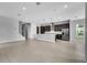 Open concept living space featuring a kitchen island and stainless steel appliances at 8226 Nemours Pkwy, Orlando, FL 32827