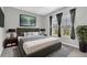 Bedroom features a king bed and large windows, providing ample natural light at 8226 Nemours Pkwy, Orlando, FL 32827