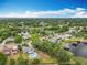 Aerial view of neighborhood, highlighting mature trees, and proximity to the lake at 8606 Port Said St, Orlando, FL 32817