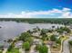 A stunning aerial view showcases the property and lakefront location at 8606 Port Said St, Orlando, FL 32817