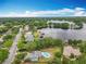 Aerial view showcasing the property and its proximity to a tranquil lake at 8606 Port Said St, Orlando, FL 32817