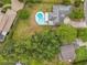 Aerial view of the property highlighting the pool and the surrounding neighborhood at 8606 Port Said St, Orlando, FL 32817