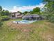 Expansive backyard showcases a private pool, patio area, and lush landscaping at 8606 Port Said St, Orlando, FL 32817