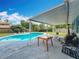 A covered patio and refreshing pool make outdoor living a breeze at 8606 Port Said St, Orlando, FL 32817