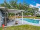 Backyard pool features a shaded patio with ample seating at 8606 Port Said St, Orlando, FL 32817