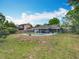 A beautiful backyard featuring a sparkling pool, patio, and plenty of green space at 8606 Port Said St, Orlando, FL 32817