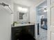 Bathroom showcasing granite countertop vanity with mirror and tile flooring at 8606 Port Said St, Orlando, FL 32817
