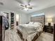Spacious bedroom with closet, a ceiling fan, and natural light at 8606 Port Said St, Orlando, FL 32817