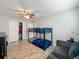 Bright bedroom with bunk beds, closet space and comfortable seating at 8606 Port Said St, Orlando, FL 32817