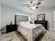 Bedroom featuring wood floors, a ceiling fan, and natural light at 8606 Port Said St, Orlando, FL 32817
