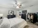 Cozy bedroom with a ceiling fan, closet and wooden floors at 8606 Port Said St, Orlando, FL 32817