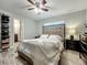 Comfortable bedroom with wood floors, a ceiling fan, and natural light at 8606 Port Said St, Orlando, FL 32817