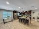 Modern kitchen with stainless steel appliances, a center island with seating, and wood-look flooring at 8606 Port Said St, Orlando, FL 32817