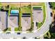Aerial view of property lines and community features lush yards, community pool, and neighborhood at 1123 Dora Parc Ln, Mount Dora, FL 32757