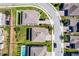 A bird's eye view displays houses with lawns alongside curving streets at 1123 Dora Parc Ln, Mount Dora, FL 32757