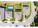 Aerial view of the properties showing backyard pool, driveways, and the surrounding community at 1123 Dora Parc Ln, Mount Dora, FL 32757