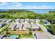 Aerial view of a community showing proximity to a body of water with tree coverage at 1123 Dora Parc Ln, Mount Dora, FL 32757