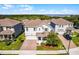 Aerial view of a well-manicured home with a brick paver driveway and lawn at 1123 Dora Parc Ln, Mount Dora, FL 32757
