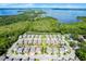 An aerial shot shows a lakeside neighborhood featuring tidy lawns and streets at 1123 Dora Parc Ln, Mount Dora, FL 32757