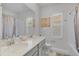 Clean bathroom with double sinks, tile floors, and shower-tub combo at 1123 Dora Parc Ln, Mount Dora, FL 32757