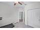 Neutral bedroom features an en-suite doorway and closet at 1123 Dora Parc Ln, Mount Dora, FL 32757